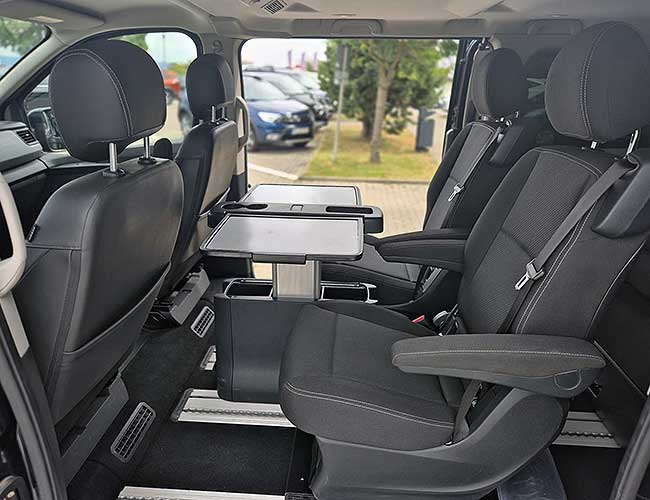 Passenger cabin of the Renault Trafic with a fold-out table between the seats